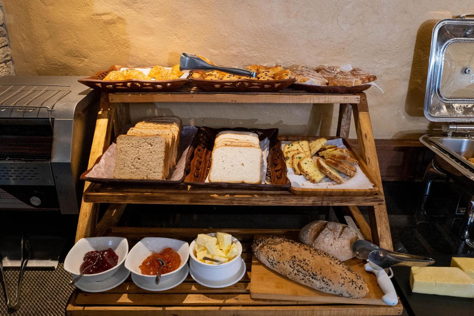 Bar Peepal Resort Pokhara Ngoại thất bức ảnh A selection of cheeses at a buffet