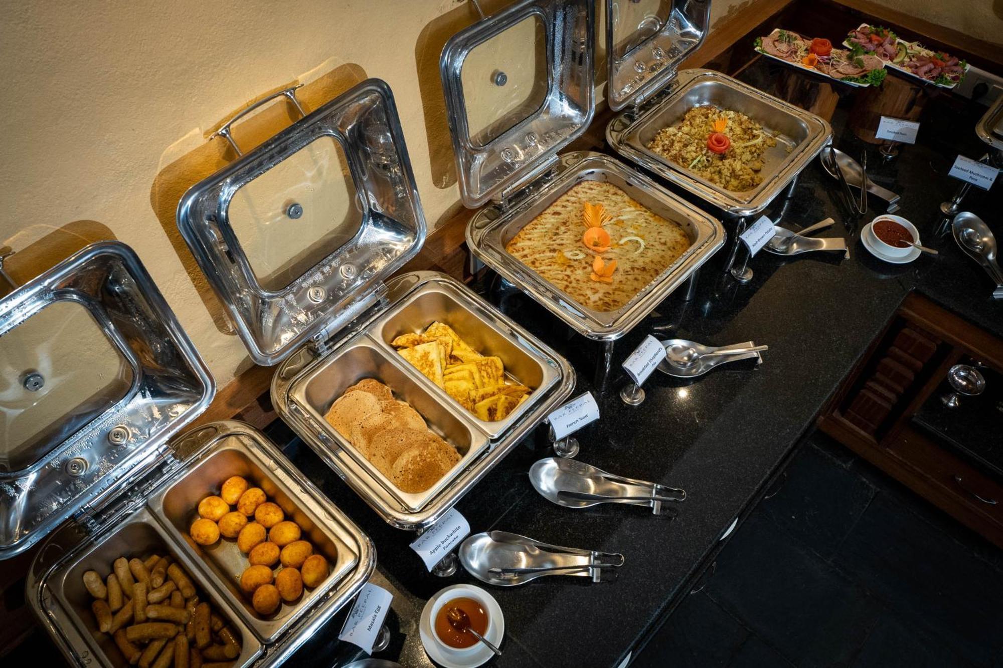 Bar Peepal Resort Pokhara Ngoại thất bức ảnh A selection of chafing dishes